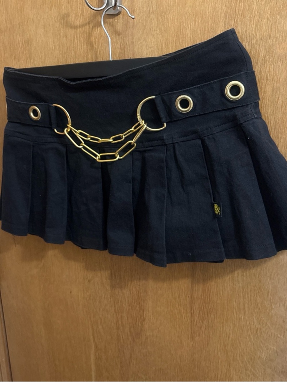 Tripp NYC Black Pleated Mini Skirt with Gold Chain Detail